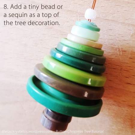 8. Add a tiny bead or a sequin as a top of the tree decoration.